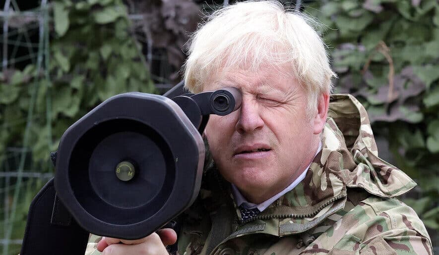 Boris Johnson wearing a military uniform and holding a rocket launcher.